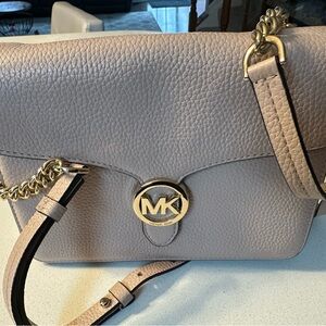 Sleek pink Leather Crossbody Bag with Adjustable Strap and Secure Closure